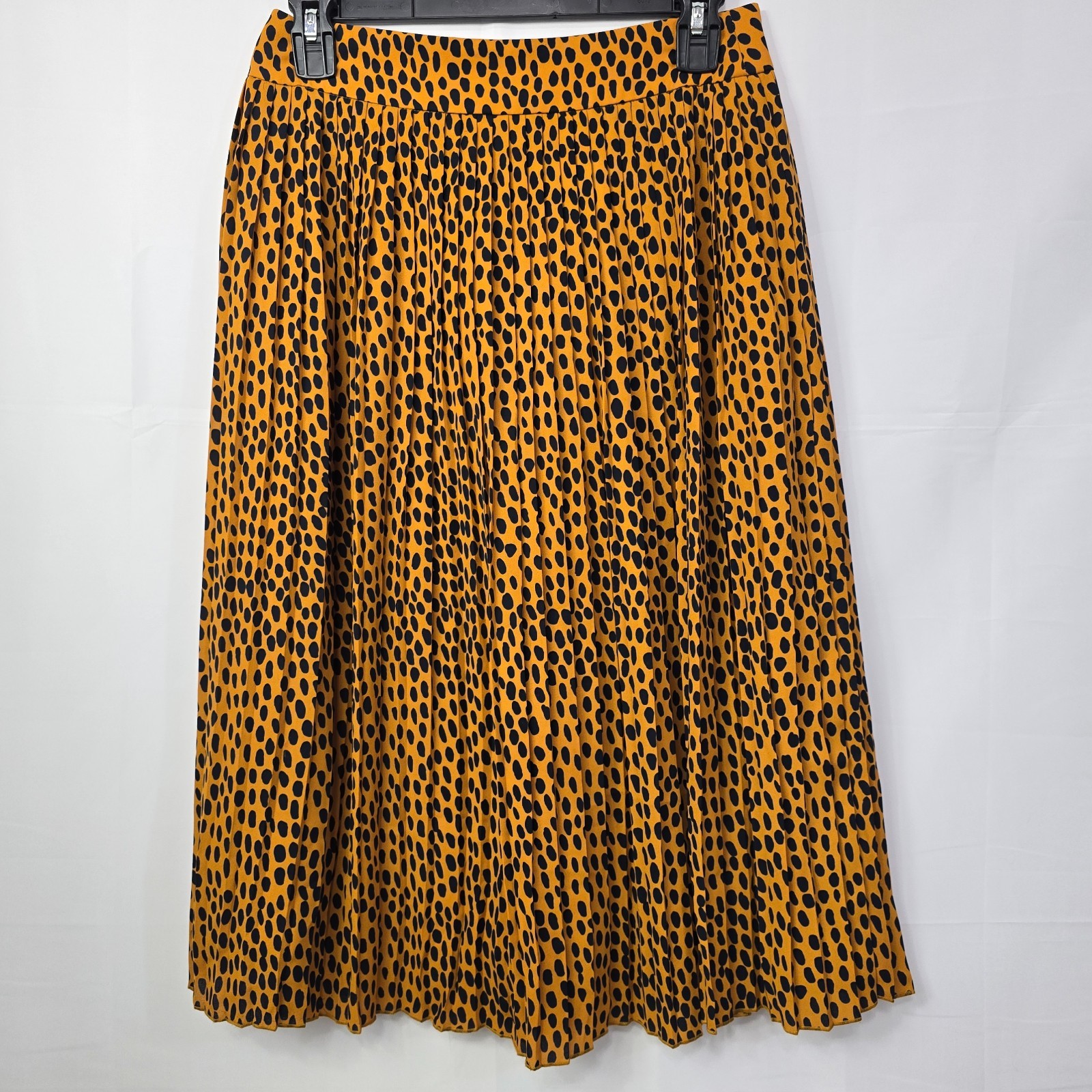 J.Crew pleated midi skirt in leopard print, labeled Women’s Size 4P.